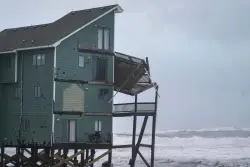 Dozens rescued as remnants of typhoon hits Alaska while nor’easter brings flooding to East Coast